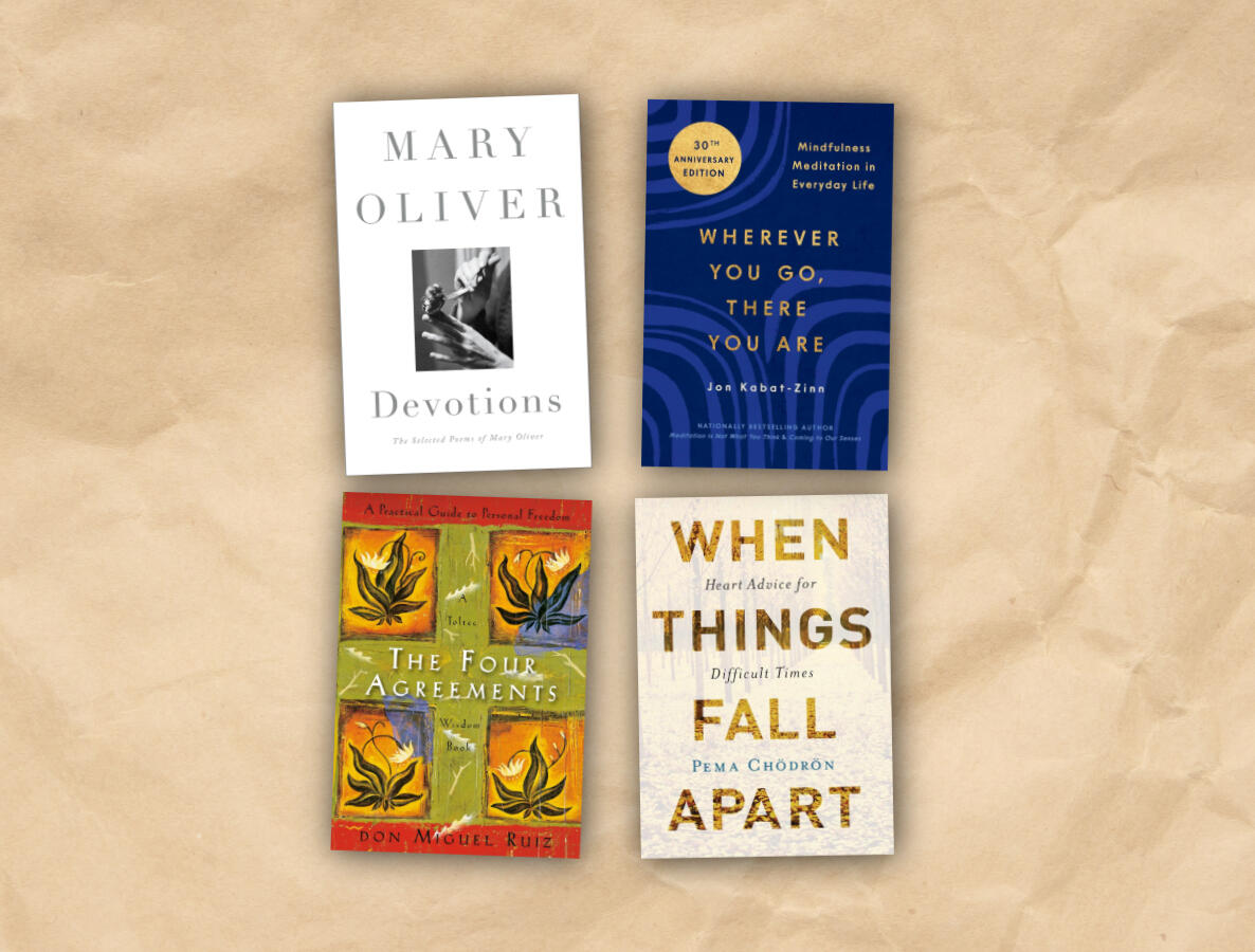 A collage of several books on mindfulness, poetry, and personal growth including Devotions by Mary Oliver, When Things Fall Apart by Pema Chödrön, The Four Agreements by Don Miguel Ruiz, and Wherever You Go, There You Are by Jon Kabat-Zinn.